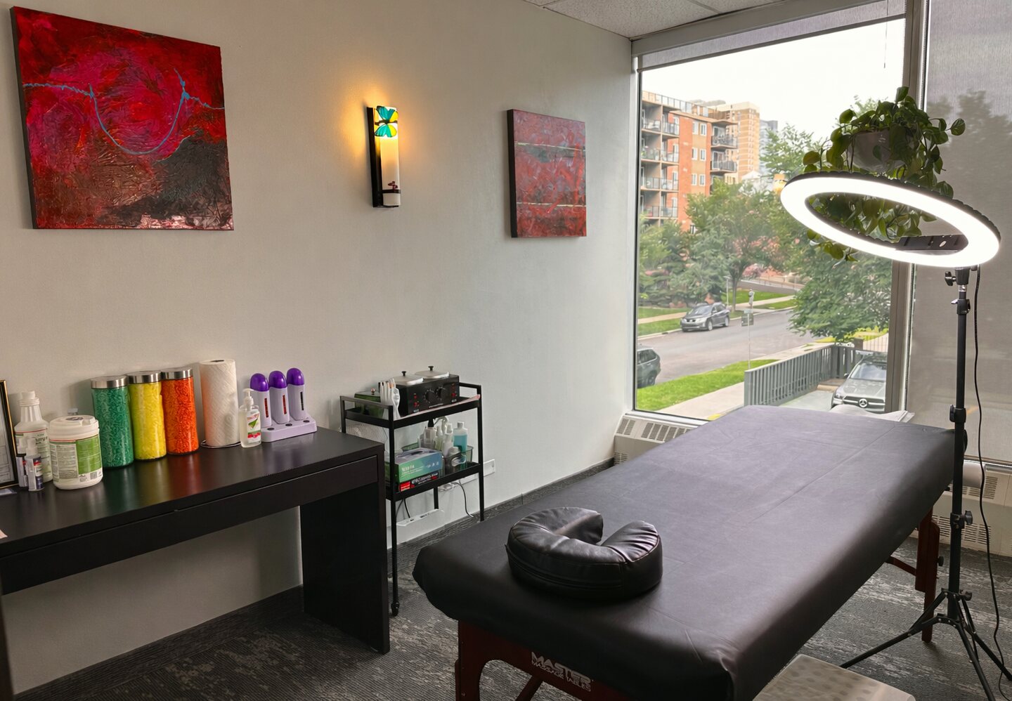Waxglow Calgary private studio treatment room with a waxing bed and natural light